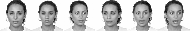 A woman with curly hair tied back